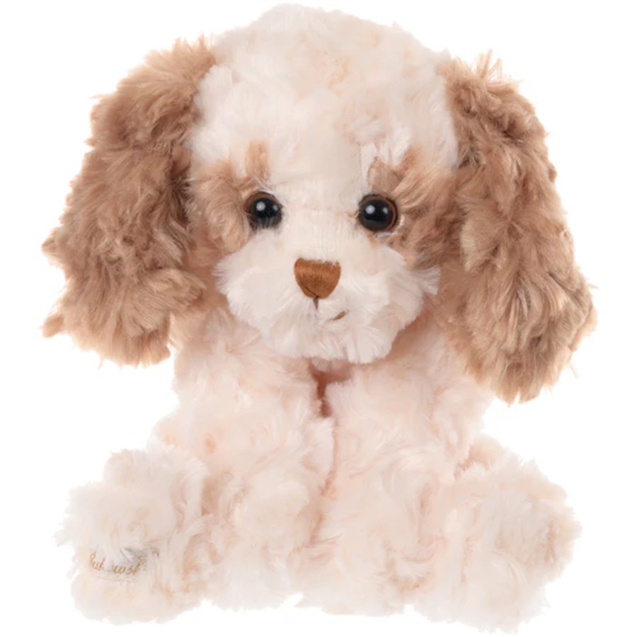 Plush toy dog with brown and white fur on a white background