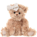 Plush teddy bear with a white bow on a white background