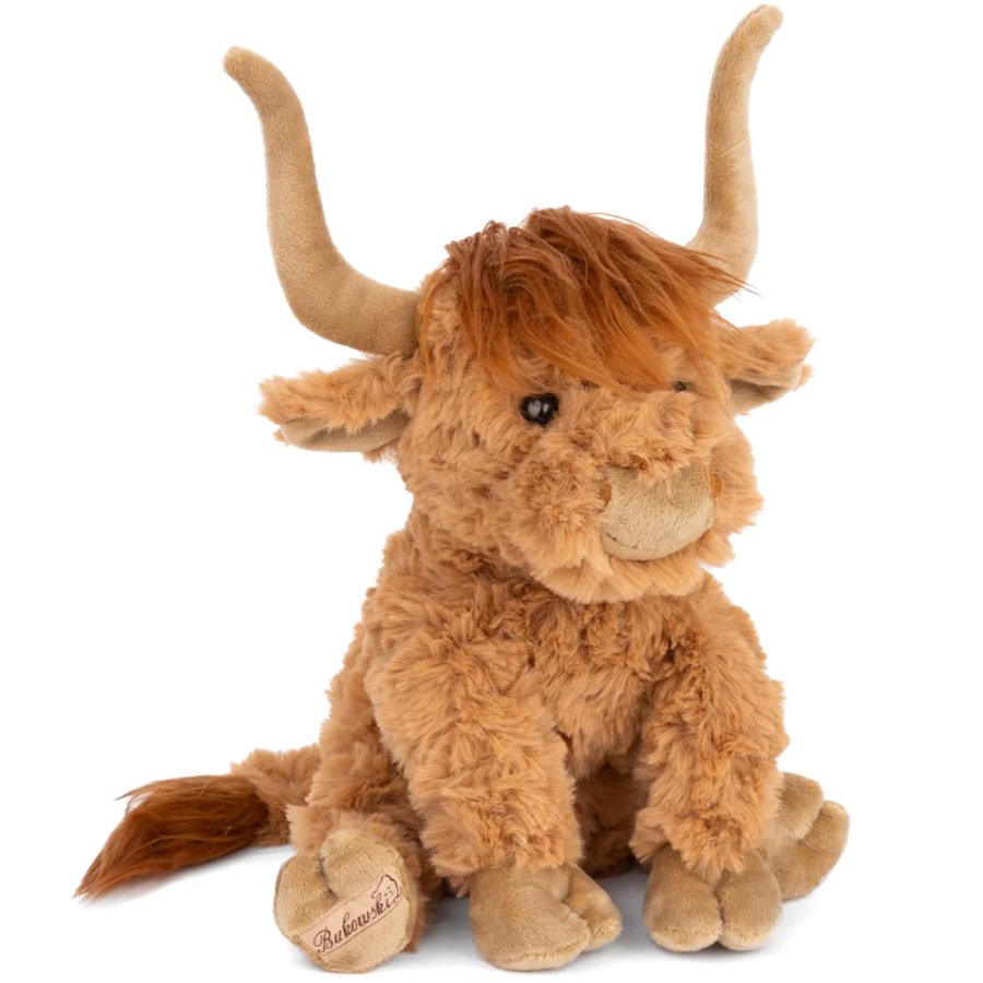 Plush toy of a brown Highland cow with horns on a white background