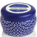 Capri Blue Aloha Orchid candle with blue lid and patterned container on a white background