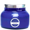 Blue candle jar with silver lid and 'capri BLUE' label on a white background