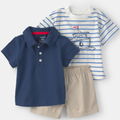 Children's clothing set with navy polo shirt, striped long-sleeve shirt, and beige shorts on a white background.