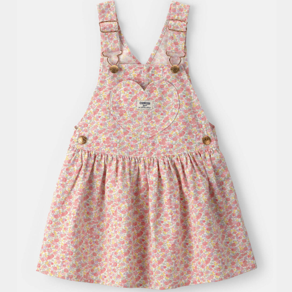 Floral patterned pinafore dress on a white background