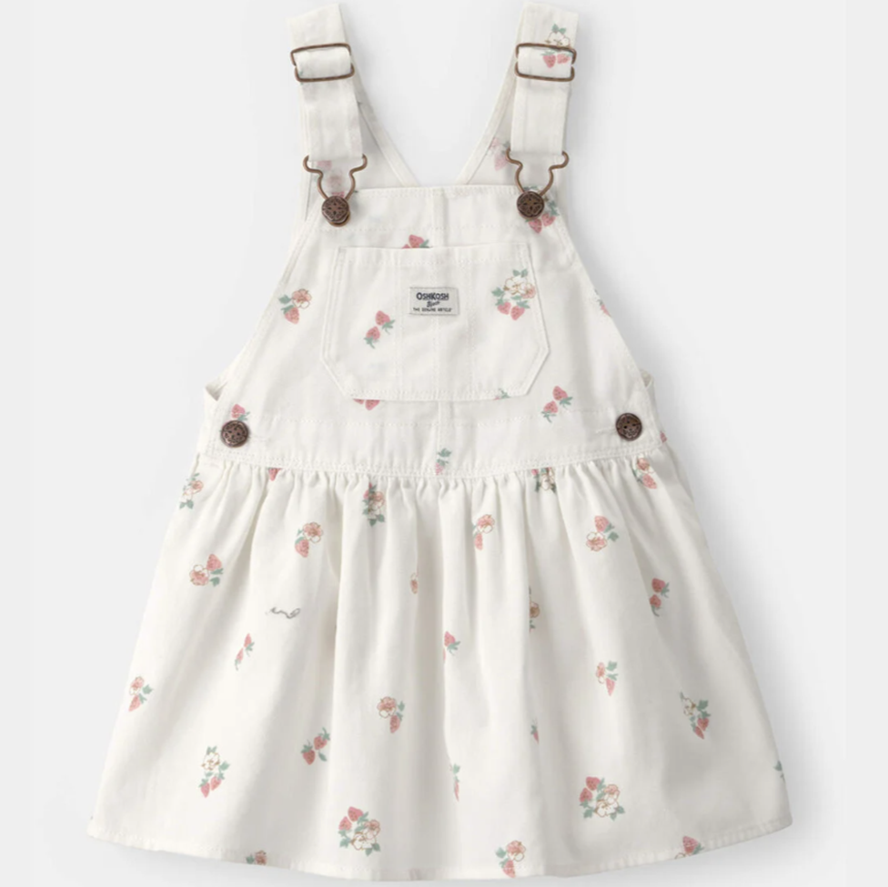 White floral overalls dress with brown buttons on a white background
