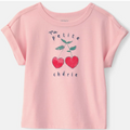 Pink t-shirt with cherry design and text on a white background