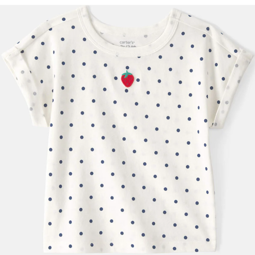 White t-shirt with blue polka dots and a red strawberry graphic on a white background