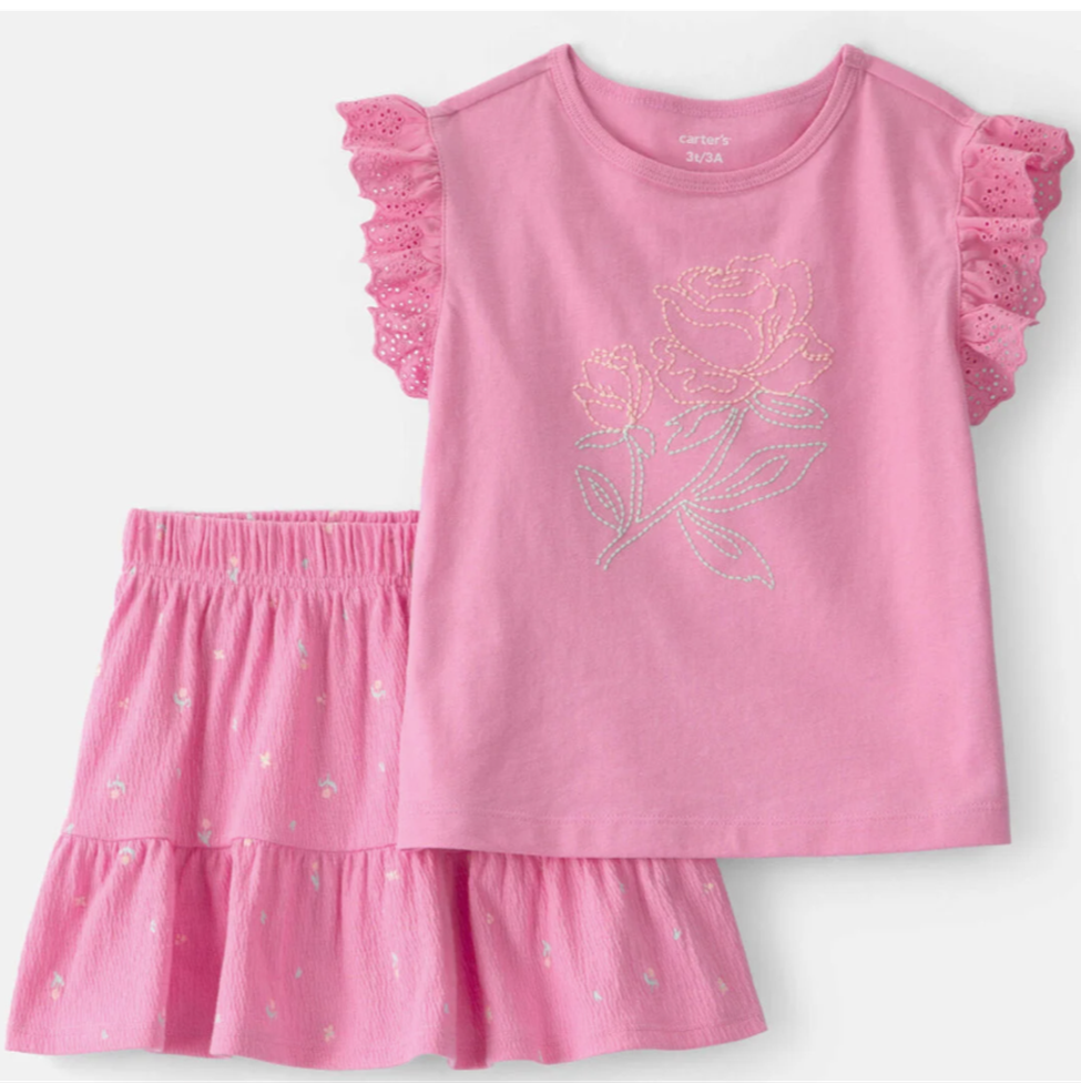 Pink children's outfit with floral design on a white background