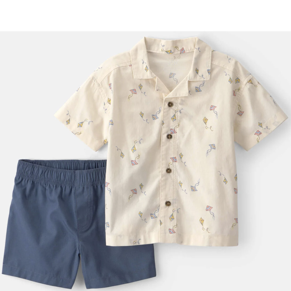 Children's outfit with a patterned shirt and navy shorts on a white background