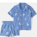 Blue children's shirt and shorts set with sailboat pattern on a white background