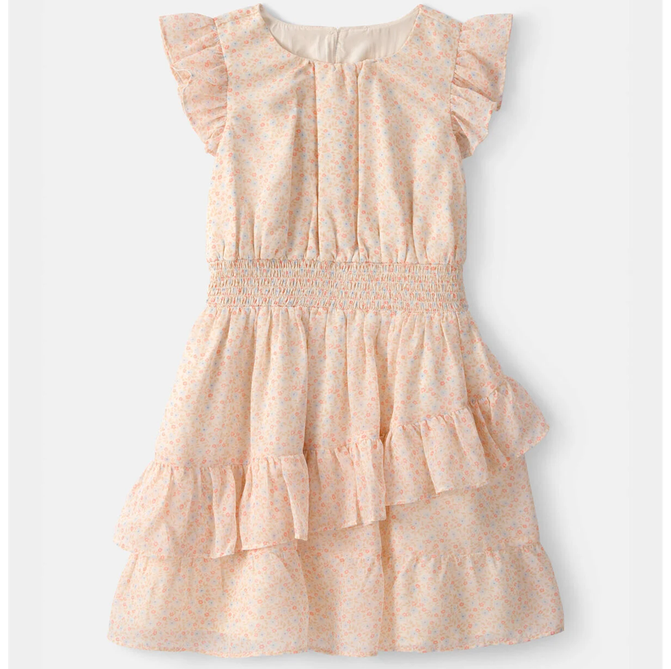 Pink floral dress with ruffled sleeves and bottom on a white background