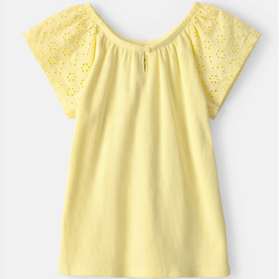Yellow blouse with floral cut-out sleeves on a light gray background