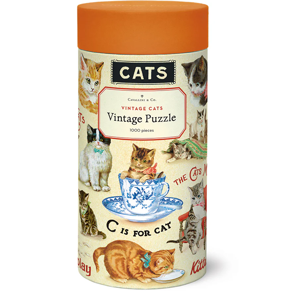 Jigsaw puzzle box with cat-themed design and orange lid