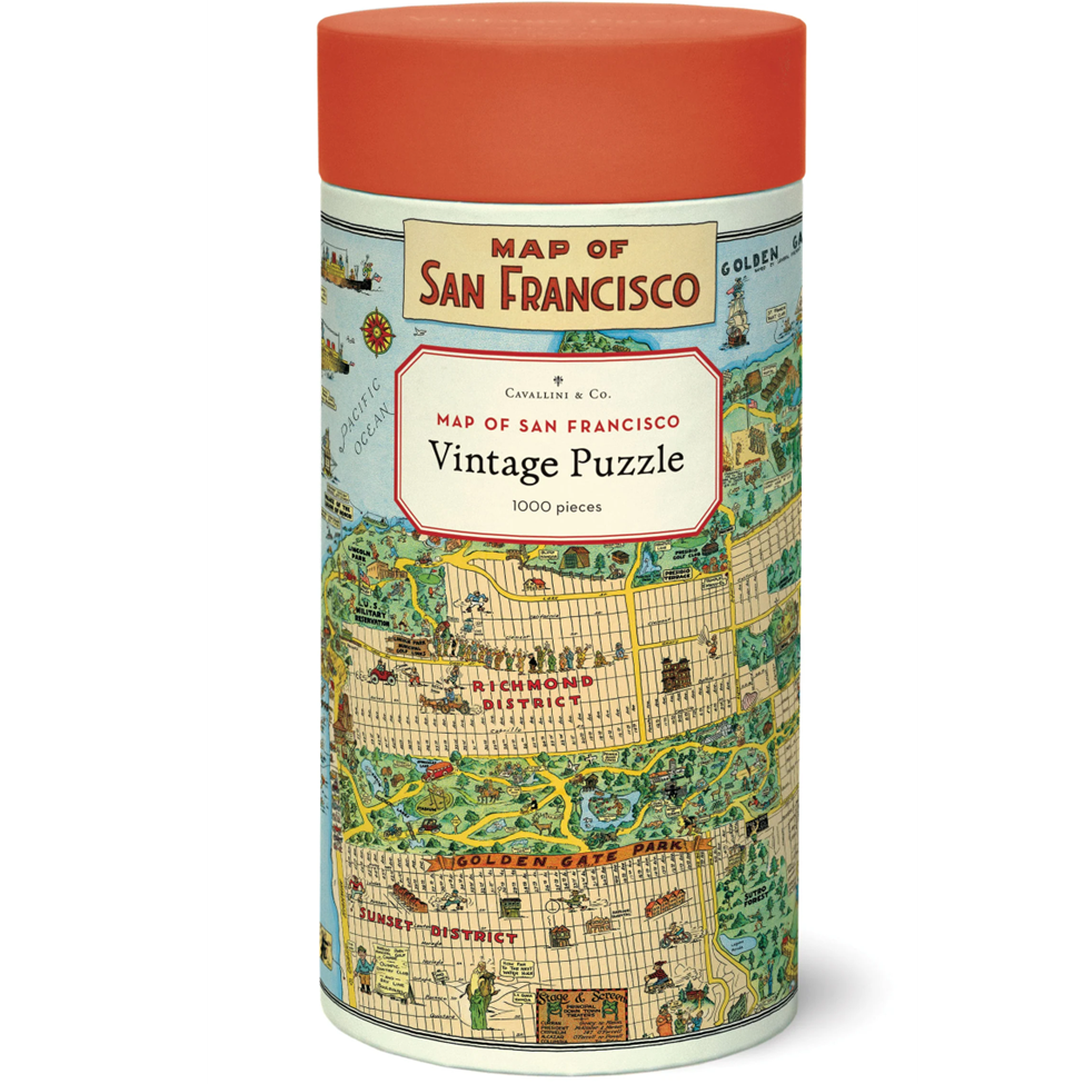 Cylindrical puzzle box with a map design and red lid on a white background