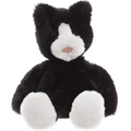 Black and white plush toy cat on a white background