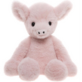 Pink plush pig toy on a white background