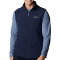 Person wearing a navy blue vest with Columbia logo on a white background