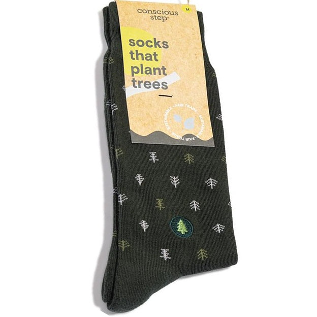 Dark green socks with tree patterns on packaging labeled 'conscious step'.