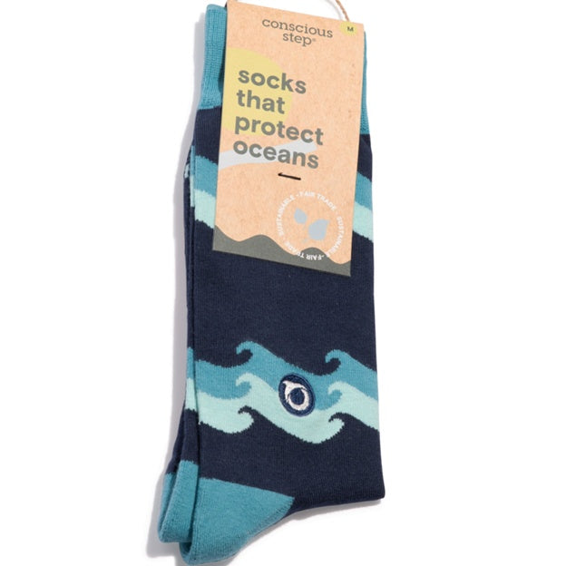 Navy sock with blue wave design and 'Conscious Step' label on a white background