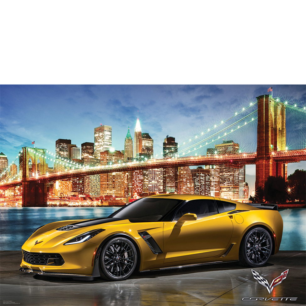 Yellow Corvette car in front of a city skyline with a bridge