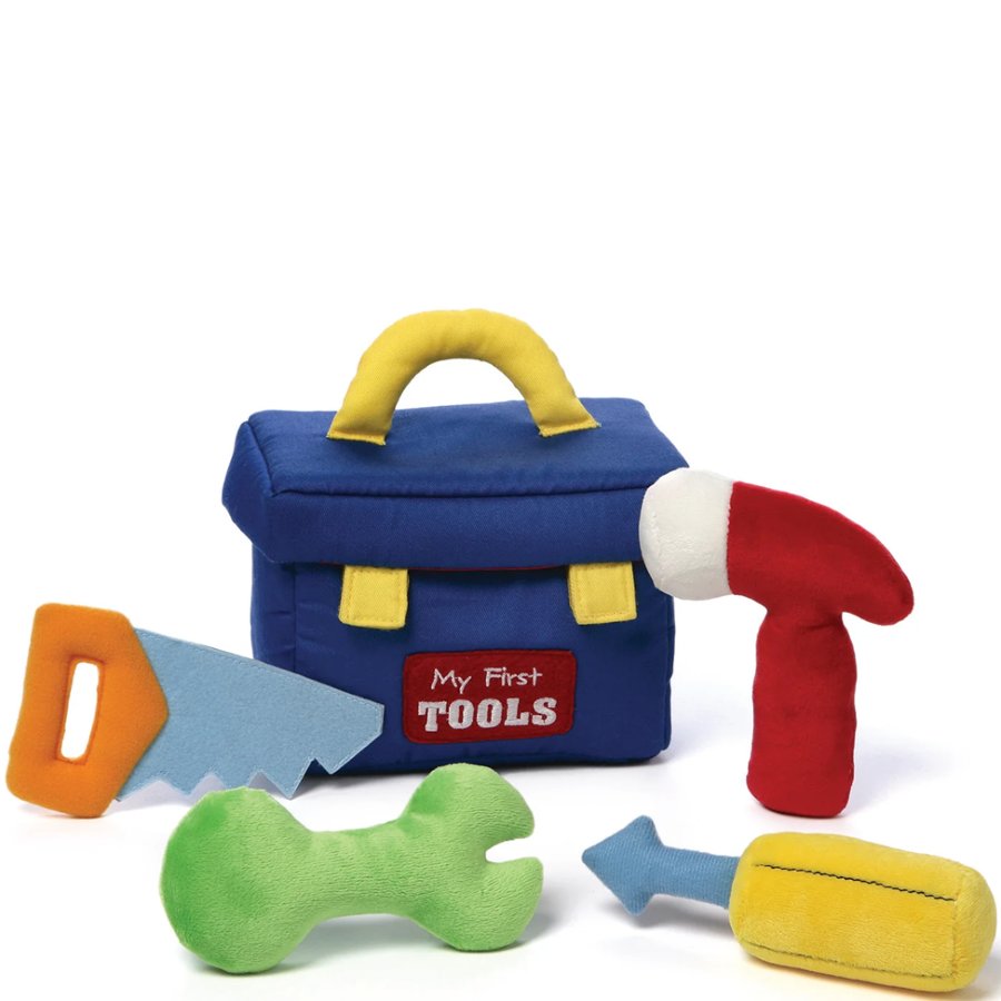 Toy tool set with a blue toolbox, hammer, saw, wrench, and hammer on a white background