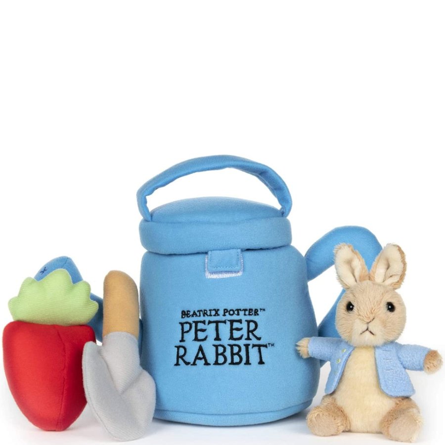 Blue watering can with 'Peter Rabbit' branding, a small rabbit figurine, and gardening tools on a white background.