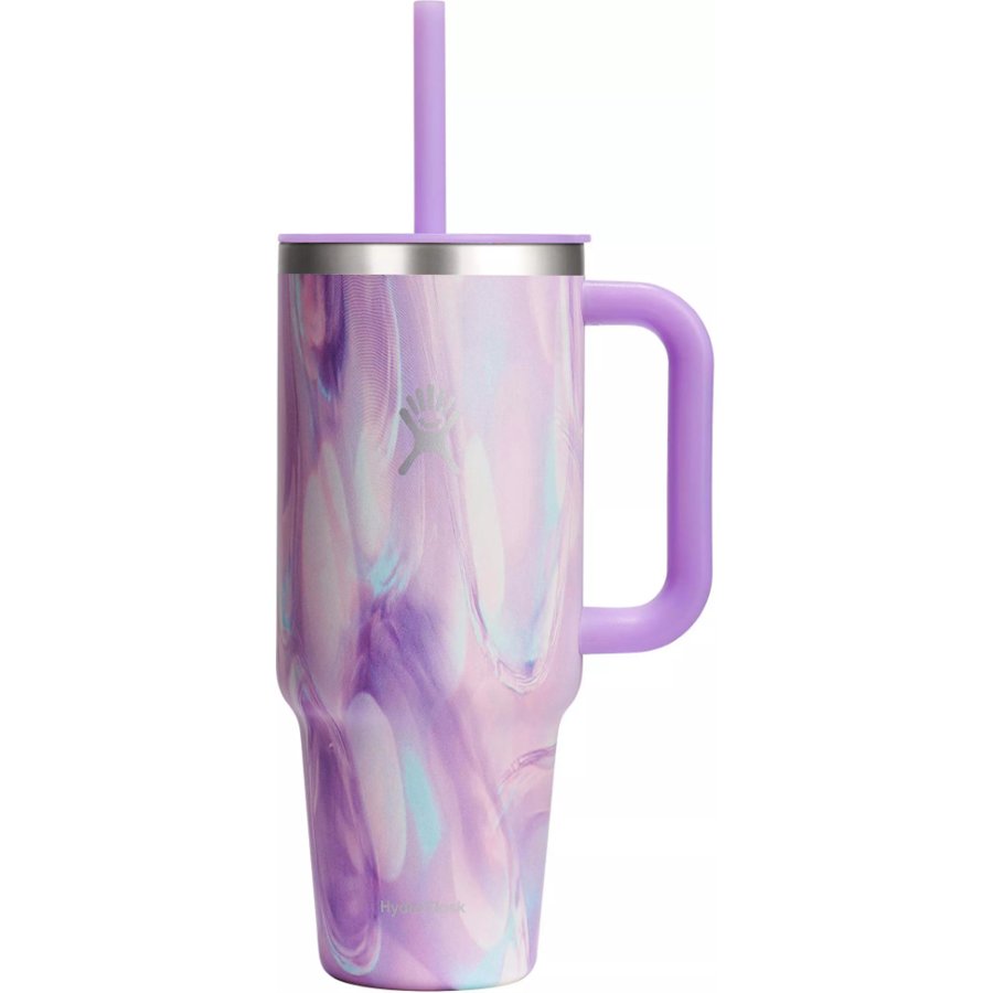 Marbled purple and pink tumbler with a handle and straw on a white background