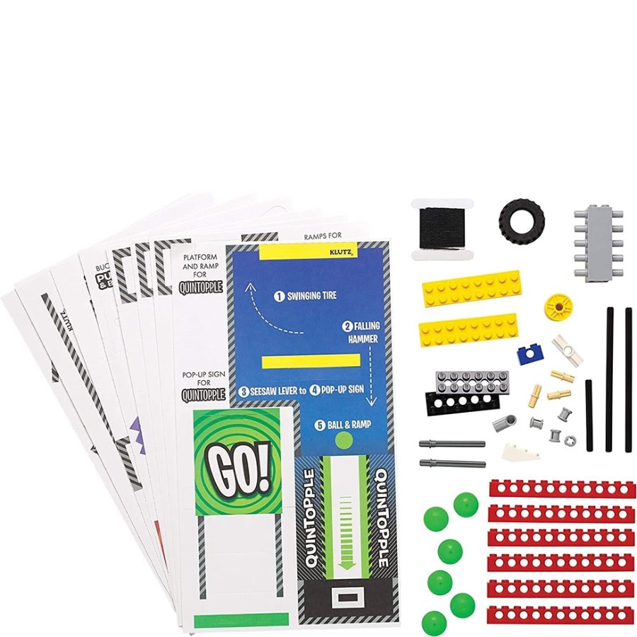 Collection of toy building blocks and accessories on a white background