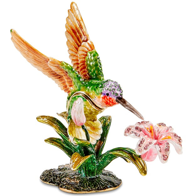 Colorful hummingbird figurine with flowers on a white background