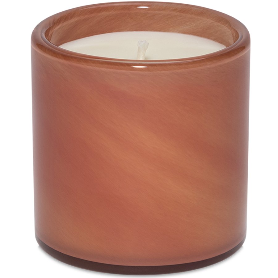 Candle in a brown glass container on a white background