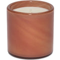 Candle in a brown glass container on a white background
