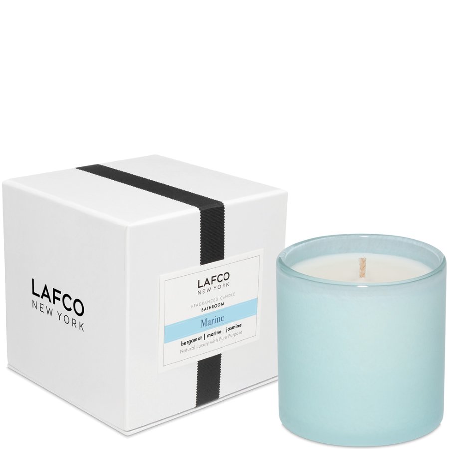 Light blue candle with white interior next to a white box featuring 'LAFCO New York' branding on a white background.