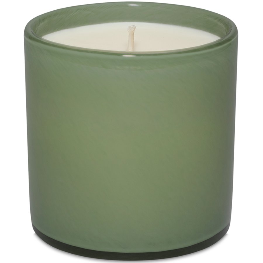 Green candle in a cylindrical container on a white background