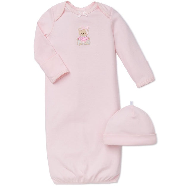Pink baby gown with matching hat on a white background