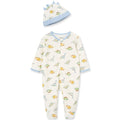 Baby onesie with dinosaur pattern and matching hat on a white background