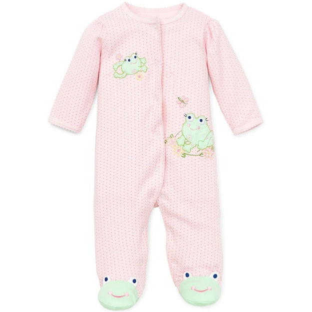 Pink baby onesie with green frog designs on a white background