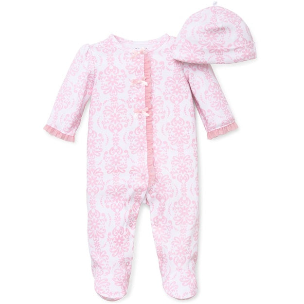 Pink baby onesie with scroll designs on a white background