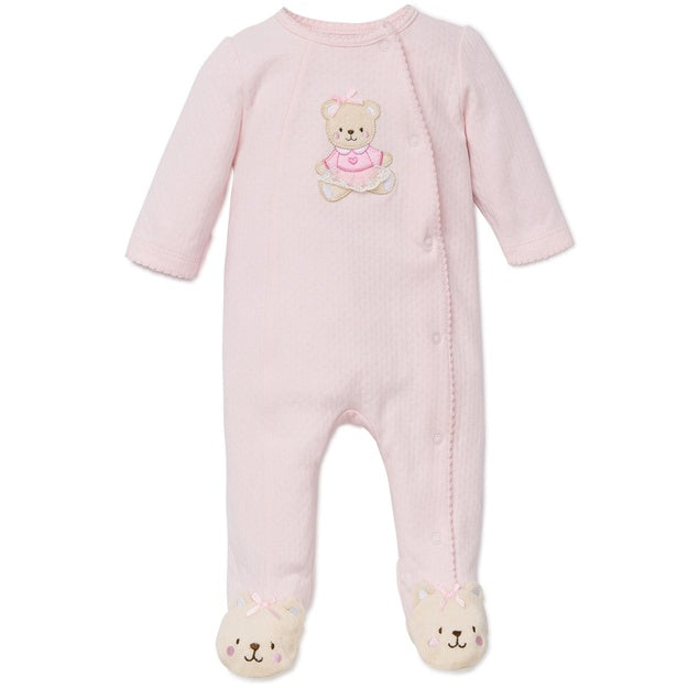 Pink baby onesie with teddy bear design on a white background