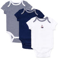 Three baby bodysuits in navy, white with stripes, and white with a sailboat design on a white background.