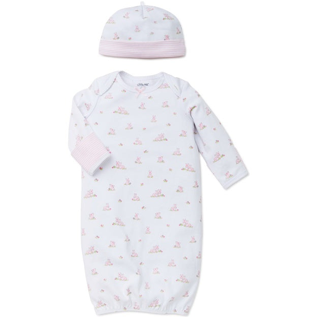 Baby gown and hat set with pink and white pattern on a white background