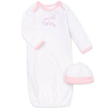 Pink baby gown with matching hat on a white background