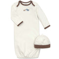 Baby gown and hat set with dogs on a white background