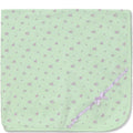 Green baby blanket with purple floral pattern and bow