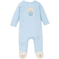 Light blue baby onesie with a teddy bear design on a white background