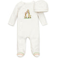 Baby onesie and hat set with giraffe pattern on a white background