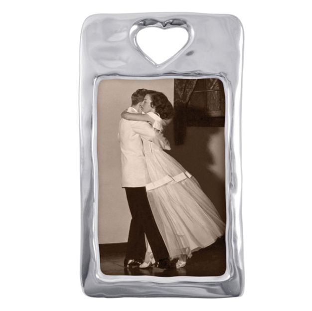 Decorative photo frame with a heart-shaped cutout on top, displaying an old photograph of a couple.