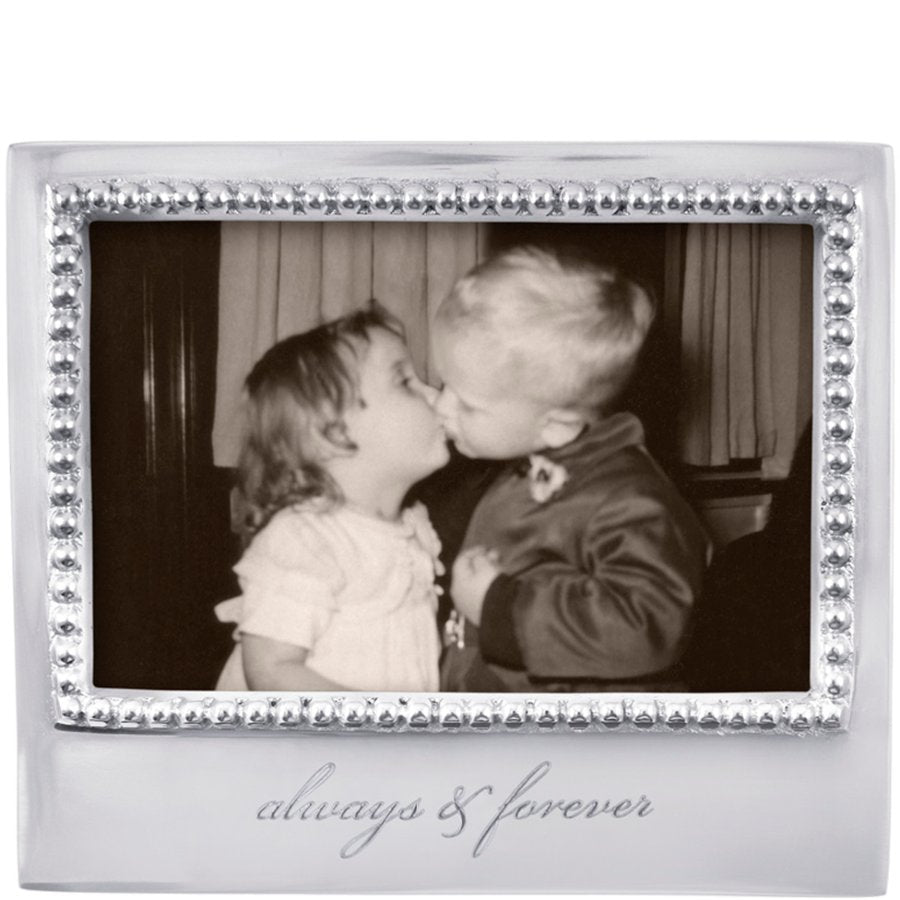 Decorative photo frame with 'always & forever' text, containing a black and white photo of two children kissing.