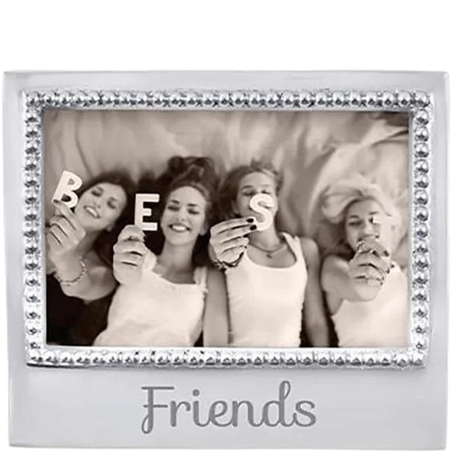 Decorative photo frame with 'BE Friends' text and a photo of four people holding letters.