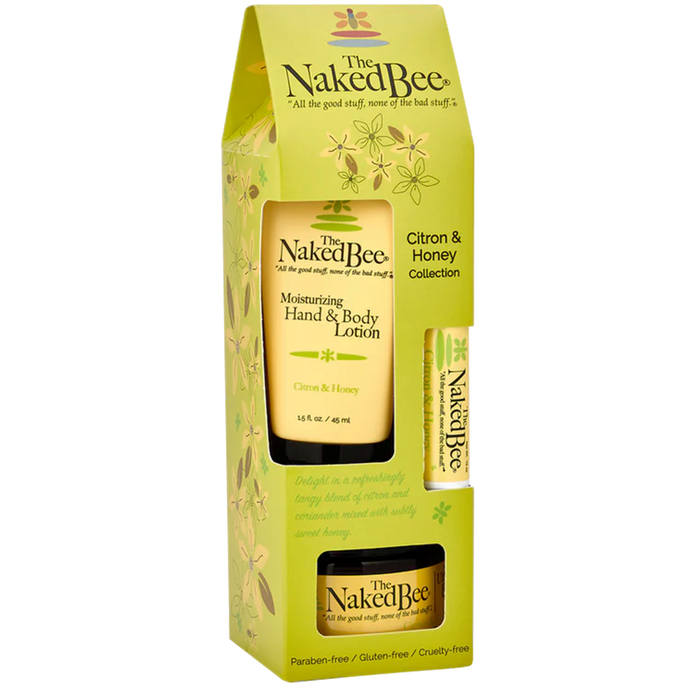 Naked Bee product set with lotion, lip balm, and body cream on a white background