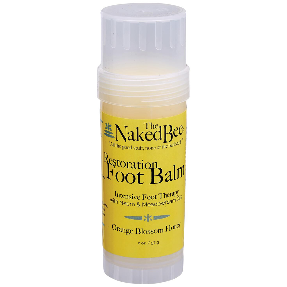Naked Bee Restoration Foot Balm stick on a white background