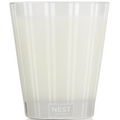 Clear glass candle with 'NEST New York' branding on a white background